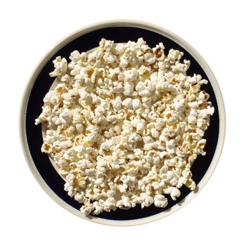 Pop corn maize in a dish isolated over white