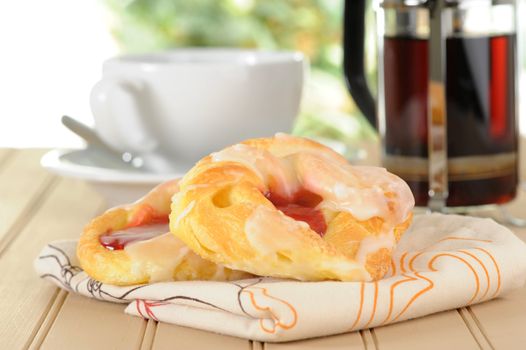 Quick breakfast of cherry danish and coffee.