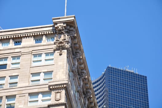 Downtown Seattle in the summer at noon, two styles of buildings.