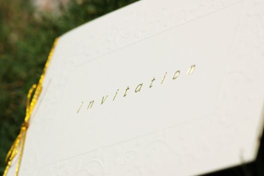 Invitation card with gold hot stamping and embossed patterns - low depth of field