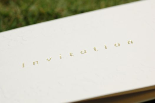 Invitation card with gold hot stamping and embossed patterns - low depth of field