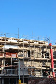 residential building under construction (blue sky background)