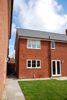 beautiful back yard garden at a typical british red brick house