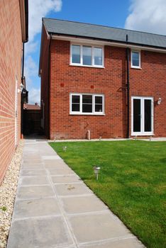 beautiful back yard garden at a typical british red brick house