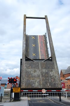 drawbridge being elevated at Gloucester docks, England