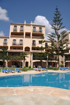 gorgeous swimming pool and hotel resort building in Marbella, Spain