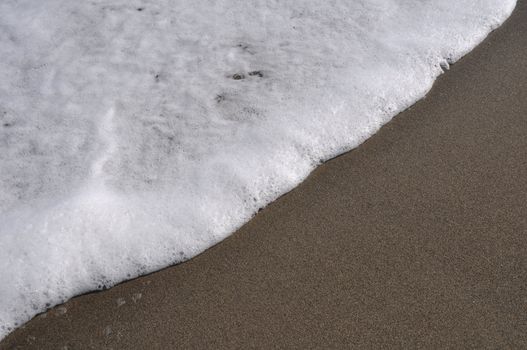 gorgeous beach sand and sea foam (copy-space available)