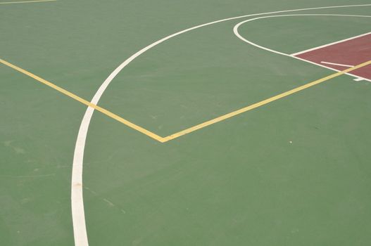 colorful basketball lines on an outdoor court