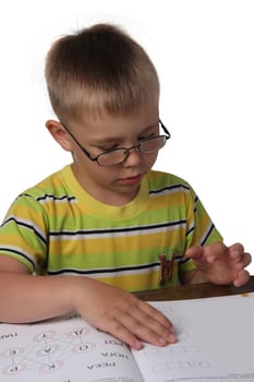 Young boy reading book, isolated