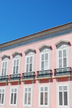 photo of a ancient and residential pink building