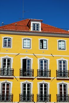 photo of a ancient and residential yellow building