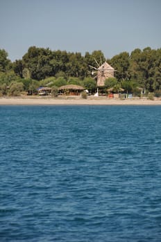 ancient windmill at Kos coastline, Greece