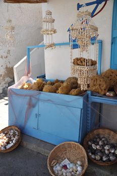 typical souvenir shop with sponges and seashells from the Kalymnos island, Greece