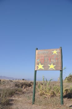 beach wooden sign at Kos island, Greece (blue sky background)