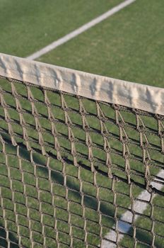 close-up of net on an outdoor tennis court