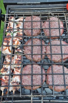 grilling fresh meat on a outdoor barbecue