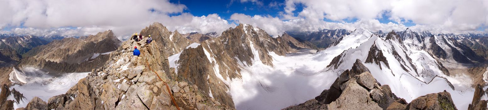 360 degree panorama of the Caucasian mountains from top Kichkidar with climbers at the top, Russia