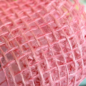 Detail of a pink ribbon fabric weave