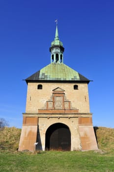 Piece of an old castle with blue sky background