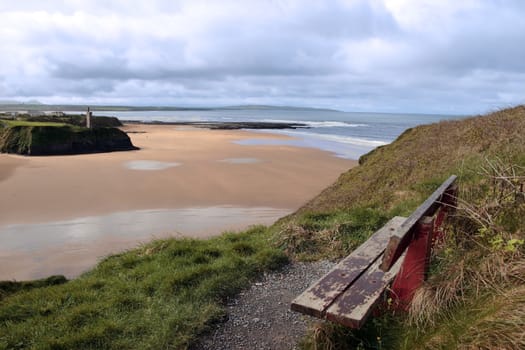 ballybunion bench in winter with view of castle beach and cliffs