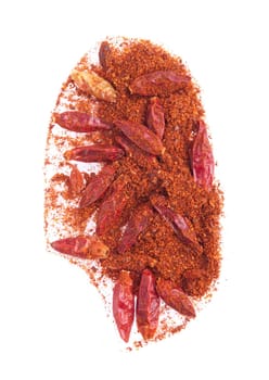 spicy chili powder with dry red peppers isolated on white background