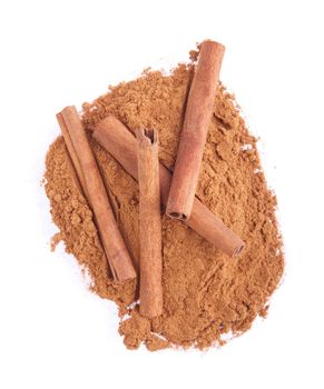 cinnamon spice powder with sticks isolated on white background