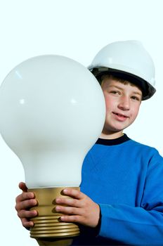 
The boy in the helmet holds a large electric bulb 