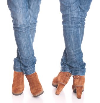 legs in jeans wearing leather fashion boots isolated on white background (front and back posing)