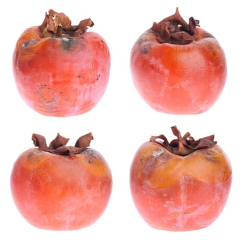 four rotten persimmon fruits isolated on white background