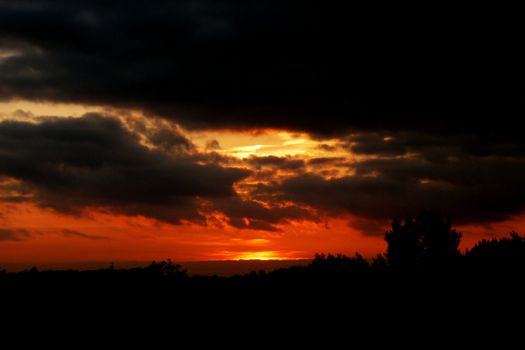 The setting sun over a landscape in Swindon