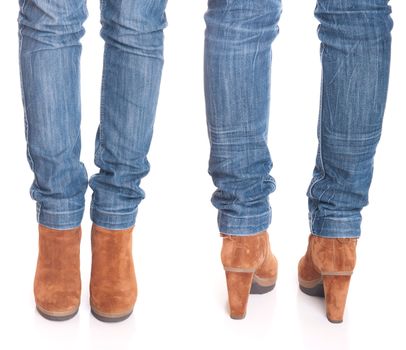 legs in jeans wearing leather fashion boots isolated on white background (front and back posing)