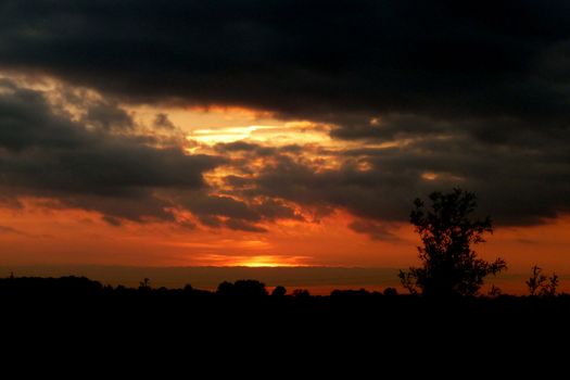 The setting sun over a landscape in Swindon