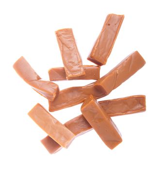 bunch of caramels pieces isolated on white background