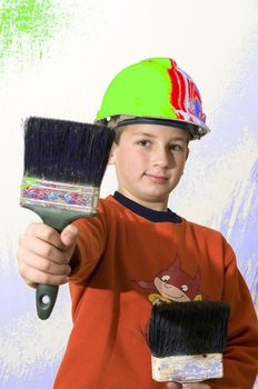 
The boy chose the paint brush which wants to paint a wall