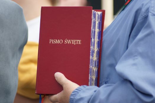 Warszaw, Poland - June 06: Woman who have a Sacred Scripture in Pilsudzkiego square on the Cross devotion Pope John  Paul II in the 20th anniversary of the Polish pope. About the pilgrimage: "Let your spirit come down and renew the  face of the earth"