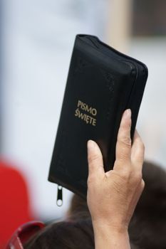 Warszaw, Poland - June 06: Woman who have a Sacred Scripture in Pilsudzkiego square on the Cross devotion Pope John  Paul II in the 20th anniversary of the Polish pope. About the pilgrimage: "Let your spirit come down and renew the  face of the earth"