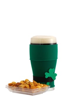 Beer snack and full beer glass in green with black belt leprechaun suit for St Patrick day celebration decorated with shamrock isolated on white background