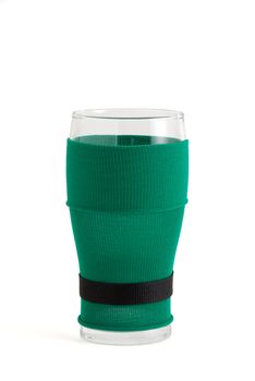Empty beer glass in green with black belt leprechaun suit for St Patrick day celebration
