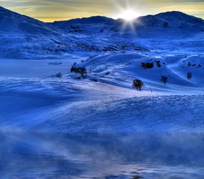 Winter landscape with misty water in the Norwegian mountains