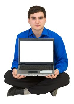 Guy sits on a floor with the laptop in a lap