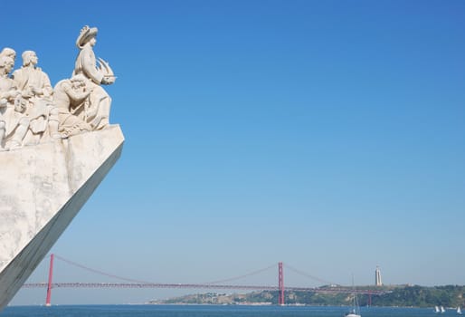 famous monument to the maritime discoveries in Lisbon, Portugal (April 25th bridge on the background)