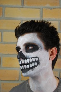 portrait of a creepy skeleton guy perfect for Carnival (brick wall background)
