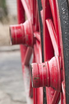 Anicent red wheel in a horse driven wagon