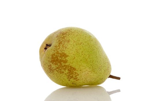 Pear lying on a reflective shiny white background.