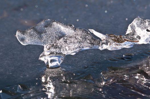 Ice formations on a pond surface in winter