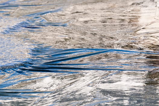 Ice formations on a pond surface in winter