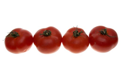 Four red tomatoes isolated on white background.