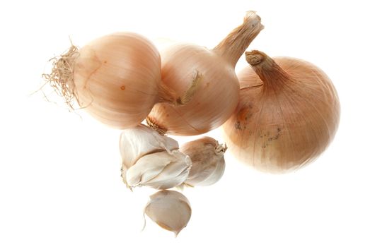 Four ripe onions isolated on a white background.