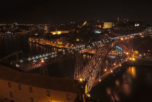 Dom Luis Iron Bridge in Porto illuminated at dusk, Portugal.
