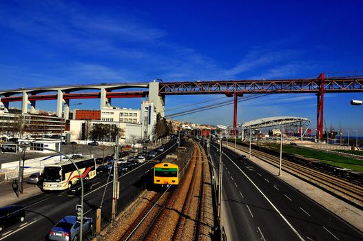 Transportation train cars in the city of Lisbon. bridge over the River Tejo